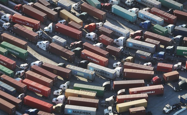 Trucks stand prepared to haul shipping containers at the Port of Los Angeles