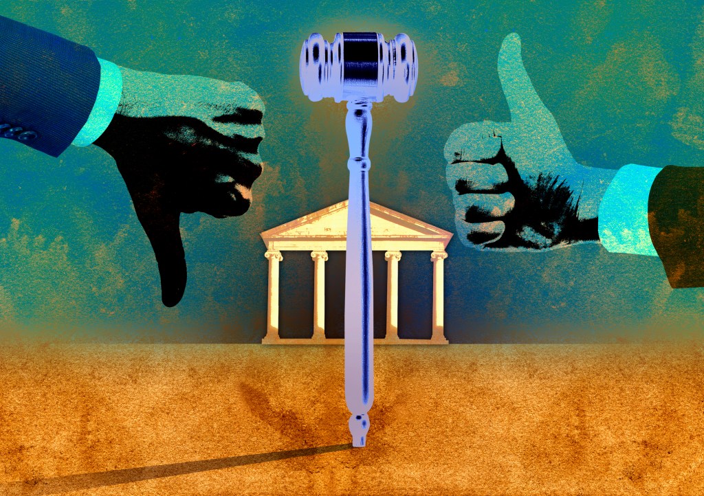 Gavel between hands making thumbs up and thumbs down signs