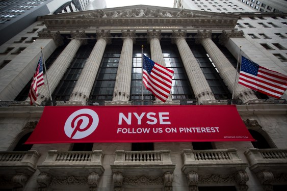 American flags fly above Pinterest Inc. signage outside the New York Stock Exchange.