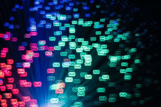 An illustration of email icons floating around in blue, green and red