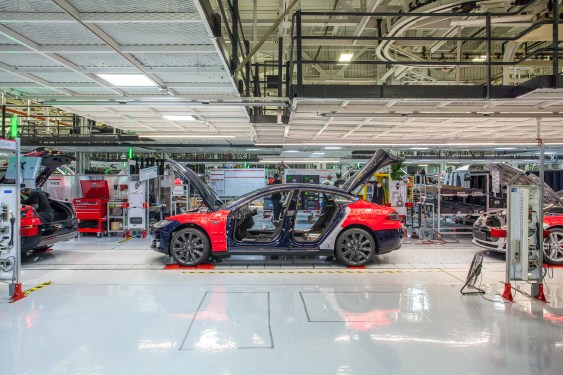 tesla vehicle factory, car partially assembled