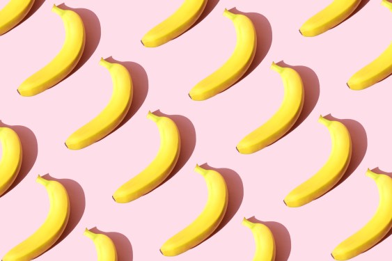 Repeated banana on the pink background