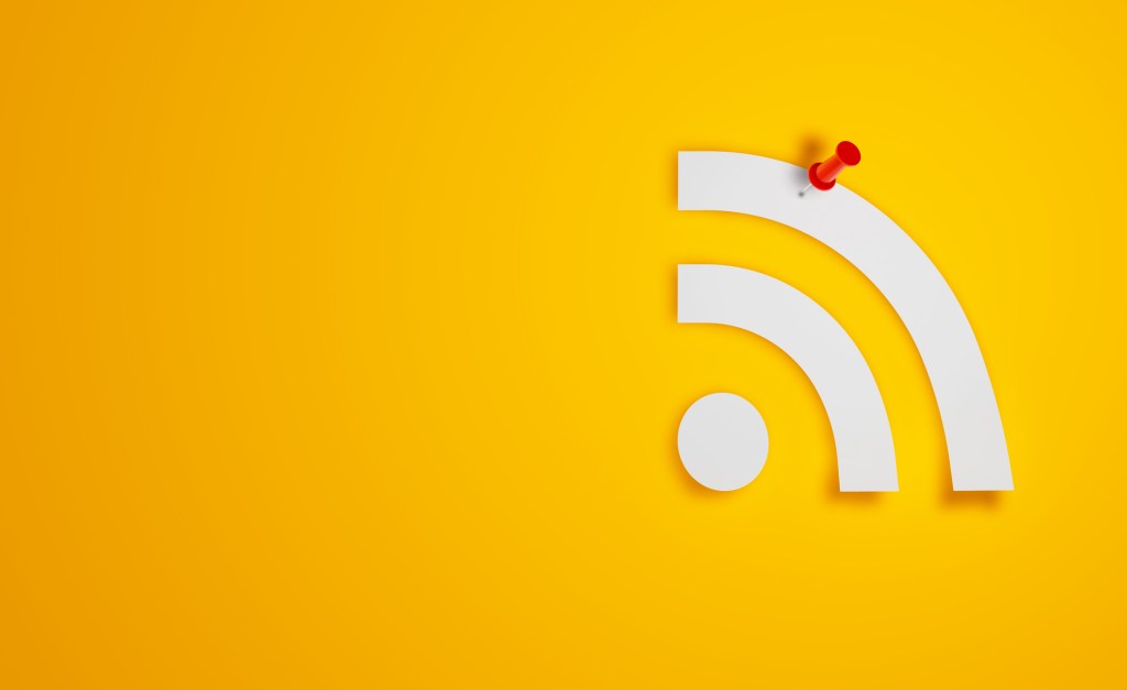 Pin Paper RSS Symbol on Yellow Background