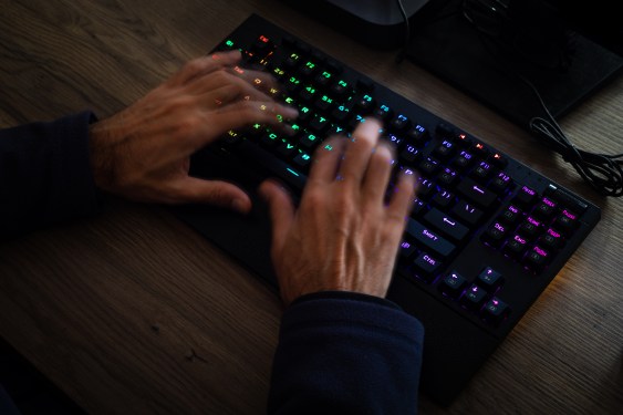 Image of a person typing on a computer.