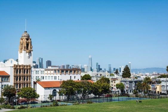 View of Mission High School and San Francisco skyline from Dolores Park, California