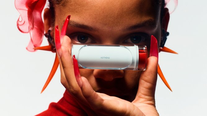 young person holding Nothing earbuds case