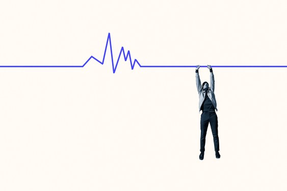 Full length of young man hanging from blue line graph for survival against white background