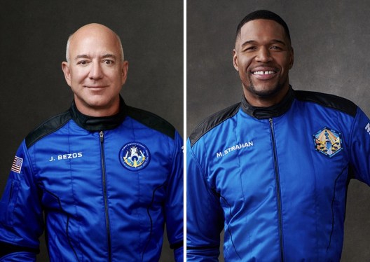 Jeff Bezos and Michael Strahan in blue flightsuits