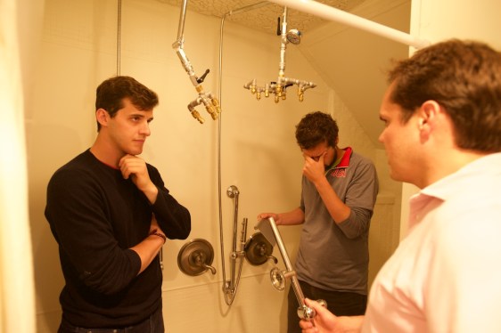 Nebia co-founders Carlos Gomez Andonaegui, Gabriel Parisi-Amon, and Philip Winter pose with shower head prototypes in 2015 (aka eons ago).