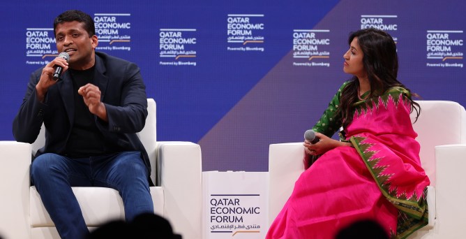 2 speakers seated onstage at Qatar Economic Forum