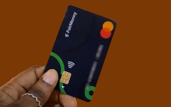 person holding s credit card