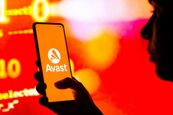 a photo of Avast's logo on a phone on a red and orange blurry background