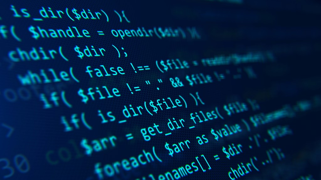 Blue code on a dark background presented at an angle.