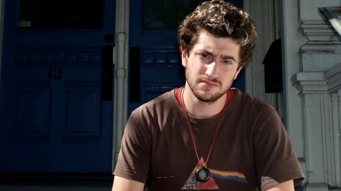 man wearing Friend AI hardware neckpiece