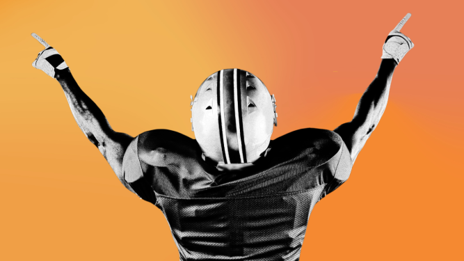 rear view of football player with hands in the air