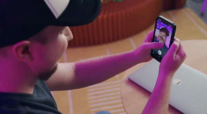 young man looking at mobile phone