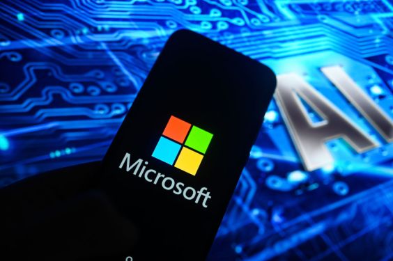 Image of a smart phone with the Microsoft logo on it with "AI" in the background