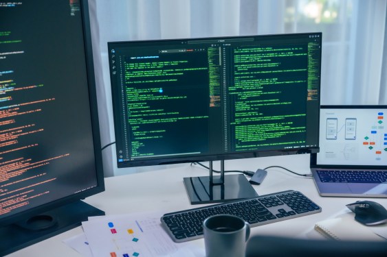 AI development, code displayed on computer screens