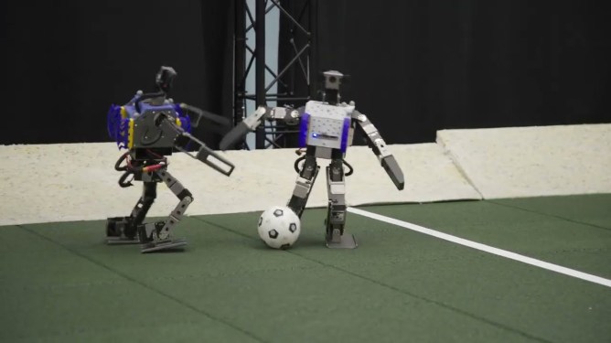 Google DeepMind miniature robots play a game of soccer.