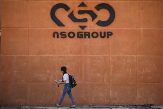 A woman walks by the building entrance of Israeli cyber company NSO Group at one of its branches in the Arava Desert on November 11, 2021 in Sapir, Israel.