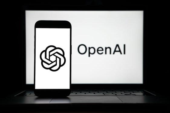 the logos of Open AI displayed on both computer and smart phone screen