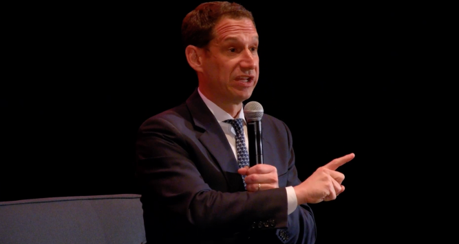 Mayor Daniel Lurie talking on stage