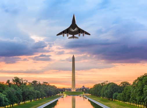 plane in flight over Washington Monument