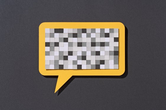 Paper Craft Pixel Mosaic Covering a Yellow Speech Bubble on Gray Background Front View, Censorship Concept.