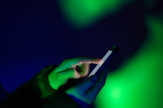 Someone tapping a smartphone.