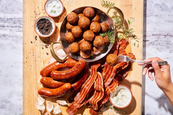 A selection of alternative meat products displayed on a table.