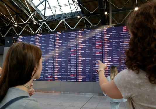 People wait for their flights at the Sheremetyevo International Airport on the outskirts of Moscow on July 28, 2025. A cyberattack on Russia's national airline Aeroflot grounded 42 flights on July 28, officials said, with a Ukrainian and a Belarusian hacker group claiming responsibility for the incident.