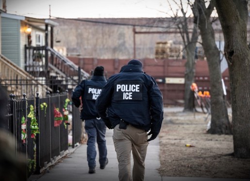 US Immigration and Customs Enforcement (ICE) agents walk down a street during a multi-agency targeted enforcement operation in Chicago, Illinois, US, on Sunday, Jan. 26, 2025.