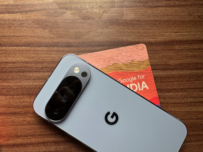 An image of a Google Pixel 10 Pro device with a coaster.