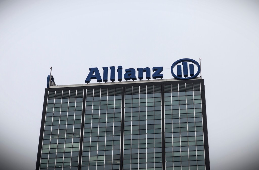 a photo of Allianz's logo at the top of a building.