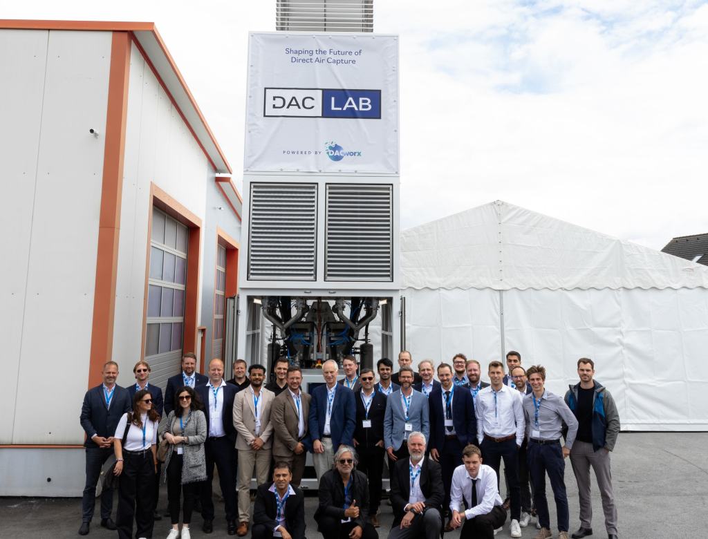 The DACLab team stands in front of one of their direct air capture units.