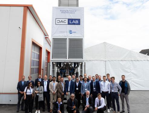 The DACLab team stands in front of one of their direct air capture units.