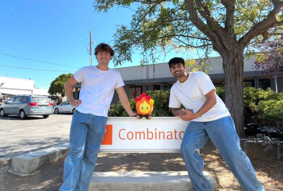 Candle founders at the Y Combinator sign