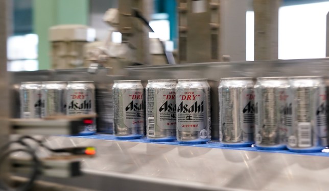 Cans of Asahi Super Dry beer move on the production line inside the Asahi Breweries Ibaraki plant, operated by Asahi Breweries Ltd., a unit of Asahi Group Holdings Ltd., in Moriya, Ibaraki Prefecture, Japan, on Tuesday, April 25, 2023.
