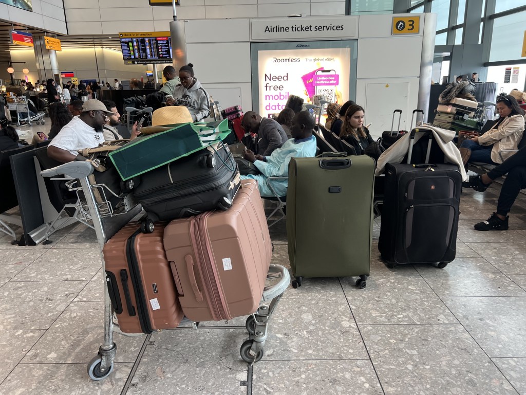 People at T4 London Heathrow Airport, after flights were delayed and cancelled at airports including Heathrow after an alleged cyber attack targeted a service provider for check-in and boarding systems.