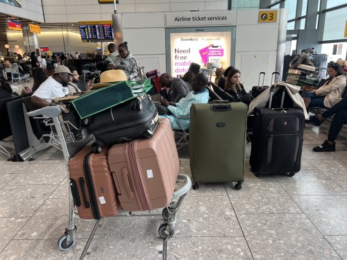 People at T4 London Heathrow Airport, after flights were delayed and cancelled at airports including Heathrow after an alleged cyber attack targeted a service provider for check-in and boarding systems.