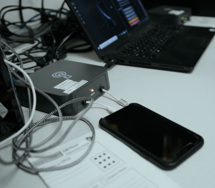 A man operates a Graykey phone hacking and unlocking device, made by Magnet Forensics. (Image: Magnet Forensics)