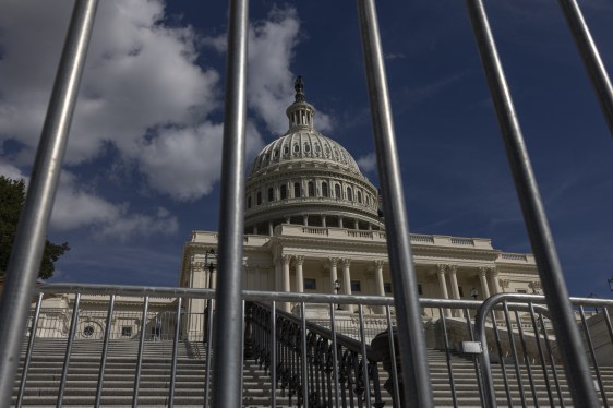 view of domed government building thru a fence
