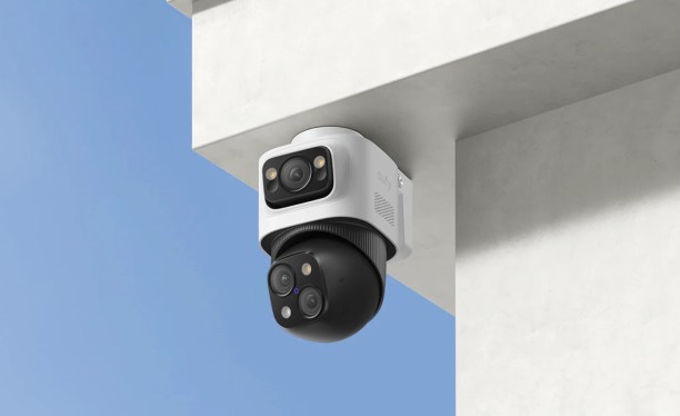 A promotional photo of a Eufy security camera and its accompanying app.